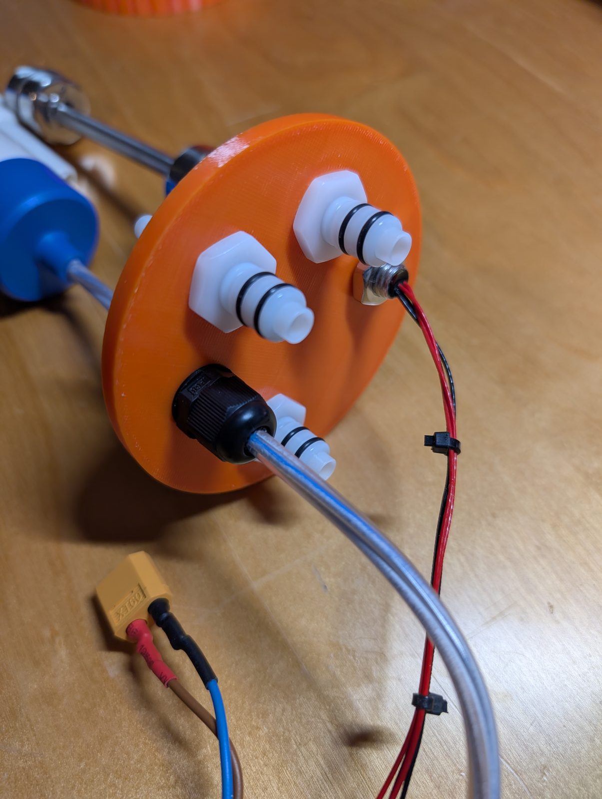The lid seen from the outside, with quick couplings and cable gland fitted