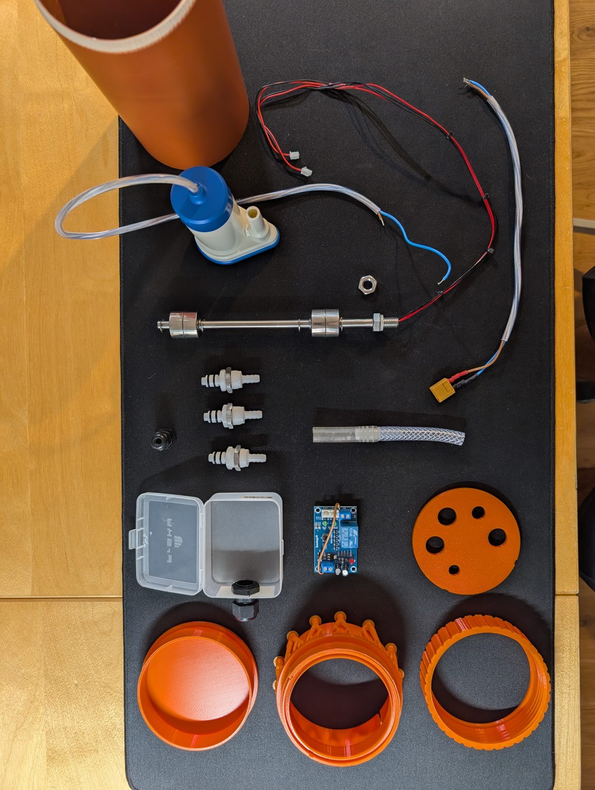 The four printed parts and everything else, laid out before assembly